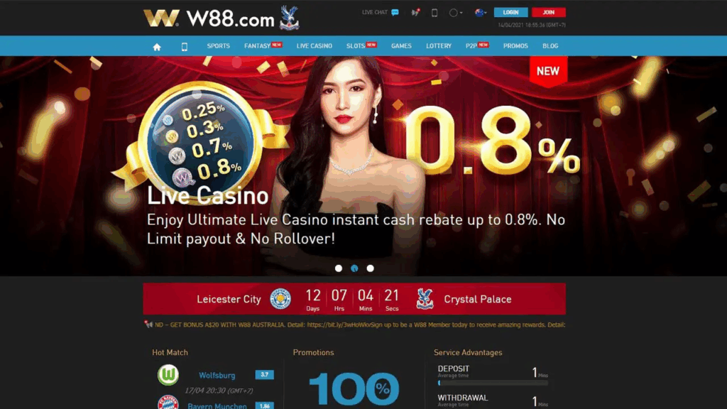 Một phụ nữ đứng trước các hình ảnh quảng cáo cho sòng bạc trực tuyến trên trang web W88, quảng cáo chương trình hoàn tiền mặt lên đến 0.8%.